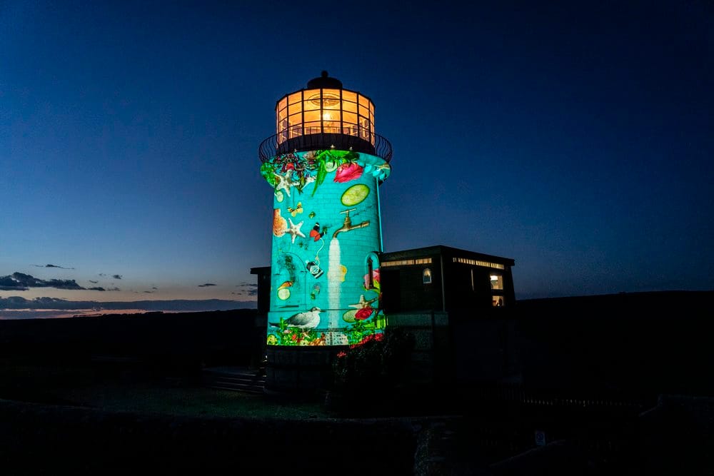 Claire Luxton's projected artwork illuminating Girvan Harbour Lighthouse for Hendrick's Neptunia Gin